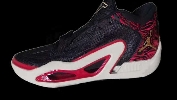 View of black, red, and white Jordan shoe.